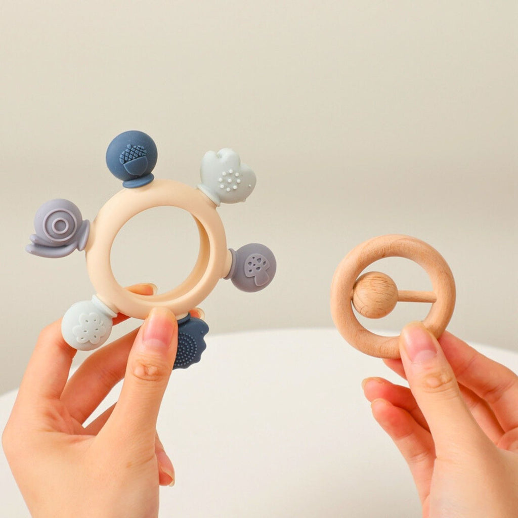 Baby silicone teether color blue with wooden ring and rattle