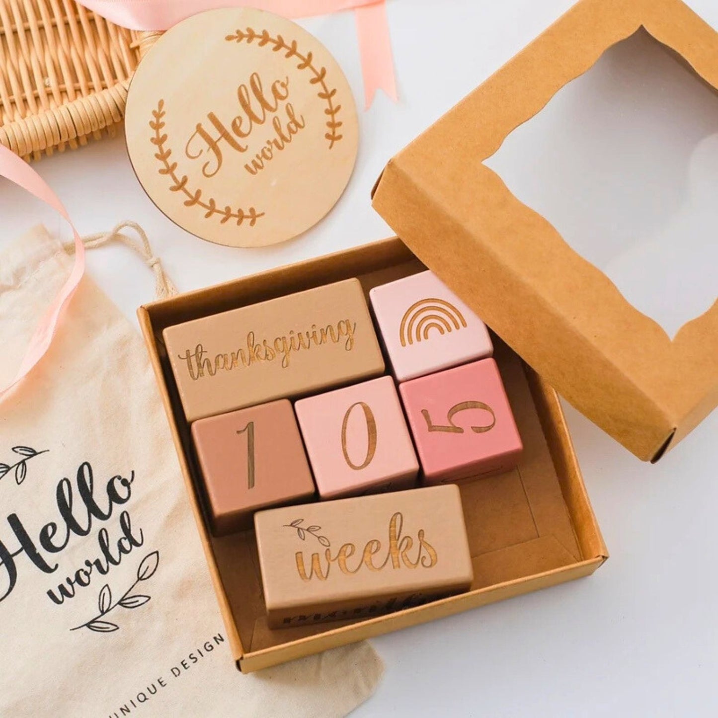 Wooden baby milestone blocks pink and natural wood color in an opened gift box